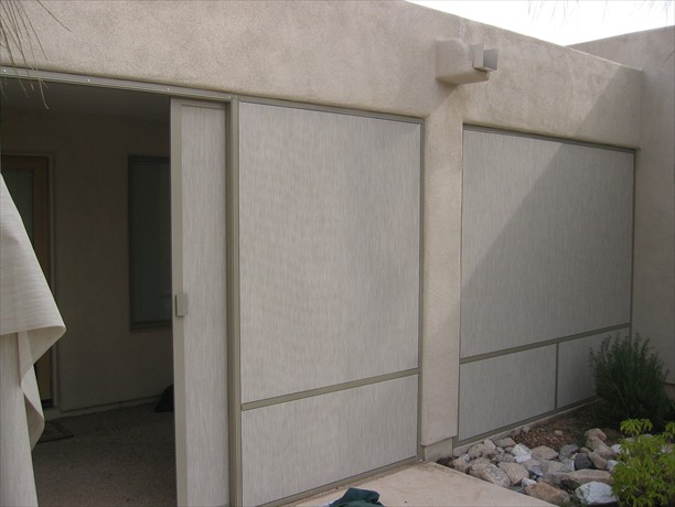 Patio slider open screened with stucco